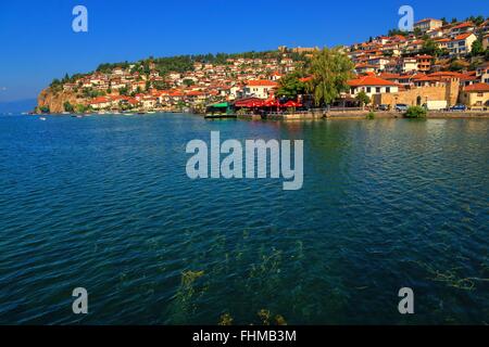 The village Ohrid at the lake Ohrid in macedonia. Shot from the lake. Lake Ohrid is one of the oldest lakes in the world. Stock Photo