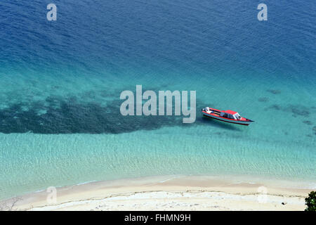 Boat docked in a beach in Nukutapu islet, Wallis Island, Wallis and Futuna, Melanesia, South Pacific Stock Photo