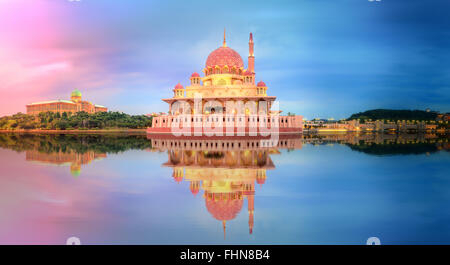 Sunset over Putrajaya Mosque and Panorama of Kuala Lumpur, Malaysia. Stock Photo