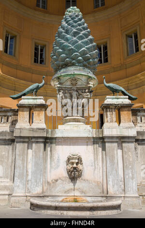 Ancient bronze Pigna, or pine cone, statue in the Vatican courtyard in Rome, Italy dating to the first century AD. Stock Photo