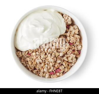 Bowl of whole grain muesli with yogurt isolated on white background, top view Stock Photo