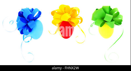 Three beautiful eggs coloring in different colors with ribbon bows isolated on white background, festive Easter collection Stock Photo