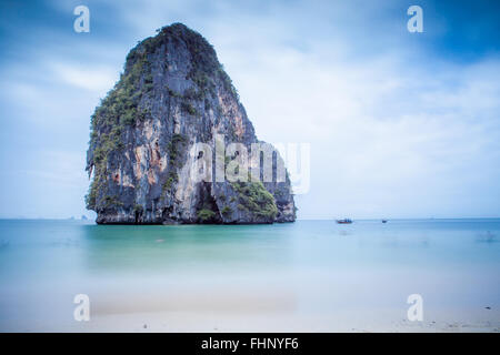 Long exposure of one of the limestone pinnacles just off Phra Nang beach in Railay, Krabi Province, thailand Stock Photo