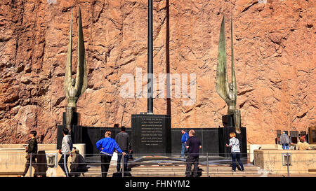 Tourists view the angel statues along a walkway at Hoover Dam Stock Photo