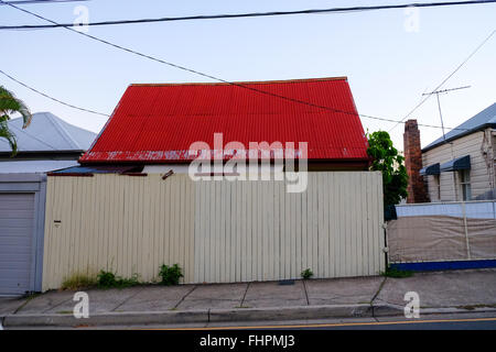 Bright red roof in West End, Queensland Stock Photo