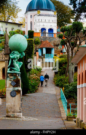 Couple walking in Portmeirion a tourist village in Gwynedd North Wales UK built between 1925 and 1975 by Clough Williams Ellis Stock Photo