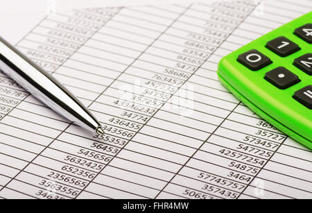 Calculator and pen on financial report Stock Photo