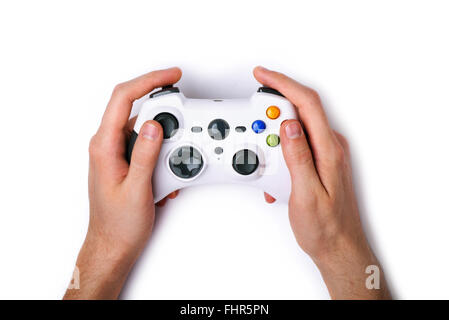 Video game console controller in gamer hands isolated on white background Stock Photo
