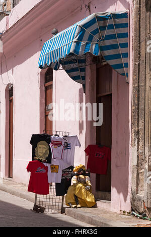 T-shirts and Cuban doll on display in street at Havana, Cuba, West Indies, Caribbean, Central America Stock Photo