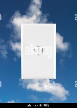 A power button isolated against a blue sky Stock Photo