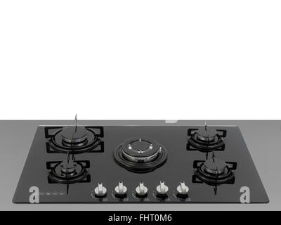 A  kitchen cooktop on a kitchen bench Stock Photo