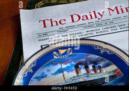 Front page of Daily Mirror dated April 16th 1912 with headline on Titanic disaster with commemorative china plate in foreground Stock Photo