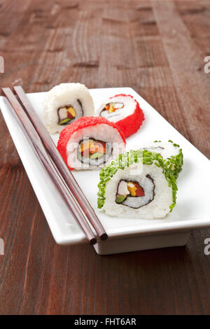 Maki. Luxurious sushi rolls on white plate. Stock Photo