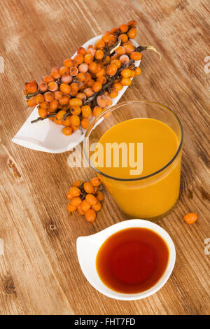 Sea buckthorn juice Stock Photo - Alamy