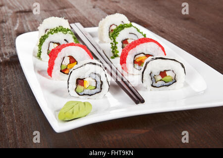 Makizushi. Sushi rolls on white plate. Stock Photo