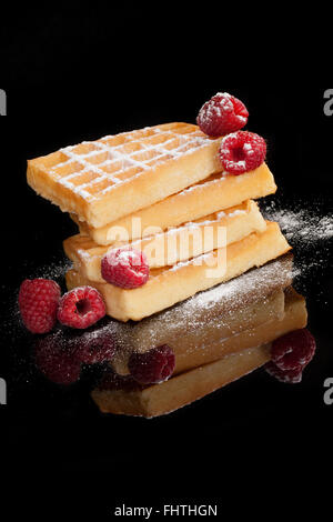 Waffles with raspberries isolated. Stock Photo