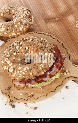 Whole grain bagel with bacon Stock Photo