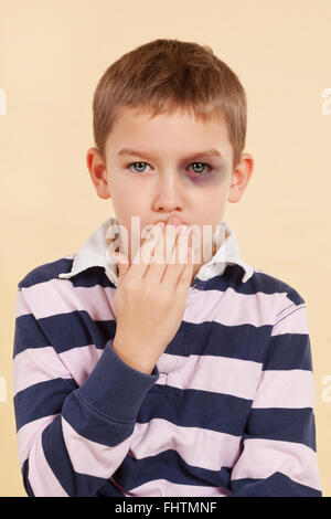 Domestic violence. Psst, don't tell anyone. Stock Photo