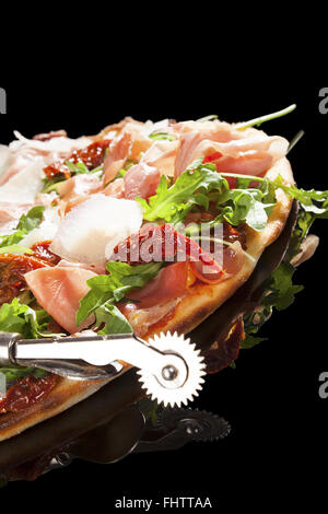 A vertical shot of a delicious prosciutto pizza Stock Photo - Alamy