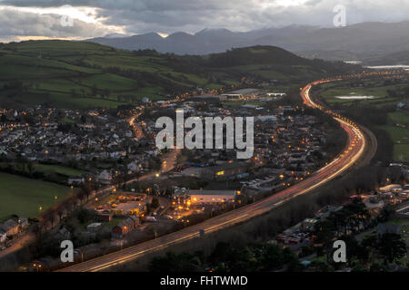 Light trails from vehicles passing through Colwyn Bay along the A55 North Wales Coast Road. Stock Photo
