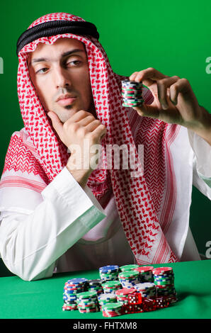 The arab man playing in the casino Stock Photo