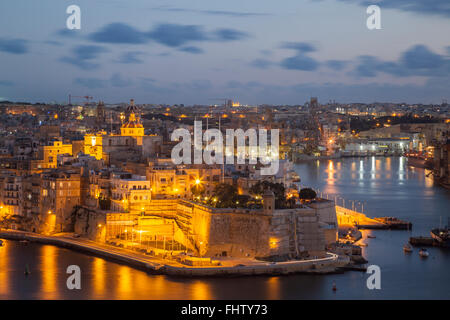 Night falls in Senglea, Malta. Stock Photo