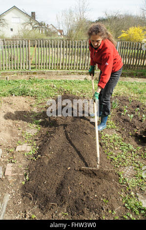 Garden bed prepare, raking Stock Photo