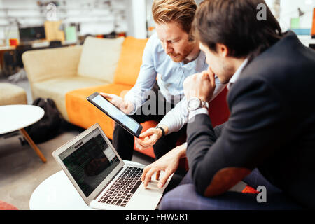 Business colleagues resting and talking during break Stock Photo