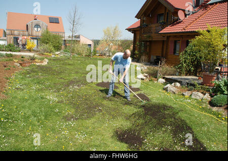 Lawn fertilizing with kompost Stock Photo