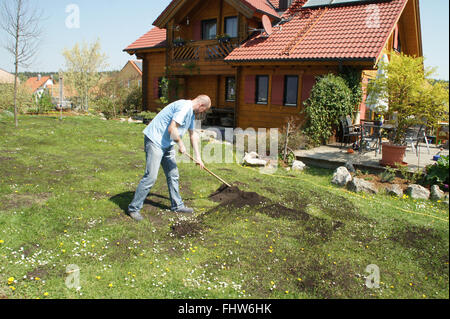 Lawn fertilizing with kompost Stock Photo