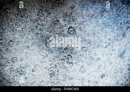 Bubble water from powdered detergent in plastic basin Stock Photo