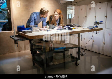 People working in modern beautiful workshop with professional equipment at hand Stock Photo