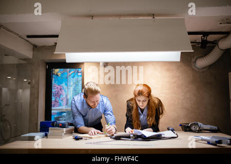Designers working in beautiful modern office and workshop Stock Photo