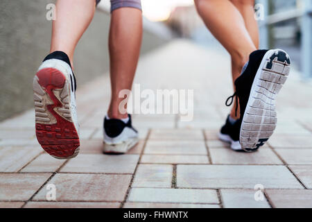 Jogging athletic women - closeup on legs Stock Photo