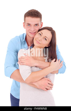 Beautiful couple on a valentine's day. Lady is standing on the front and her boyfriend emmraces her from the back. They are hold Stock Photo