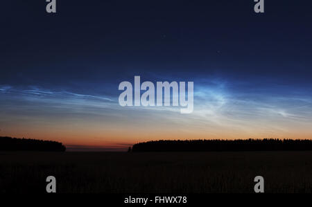 Noctilucent clouds sunset night landscape with stars Stock Photo