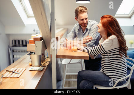 Couple in love talking smiling at home while being truly happy Stock Photo