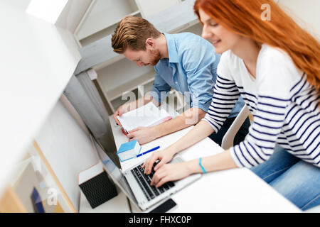 Husband and wife working from home on laptop Stock Photo