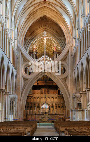 Wells Cathedral Nave. St Andrews Cross arches / Scissor arch and Jesus Christ crucified on the cross. Somerset, England. HDR Stock Photo