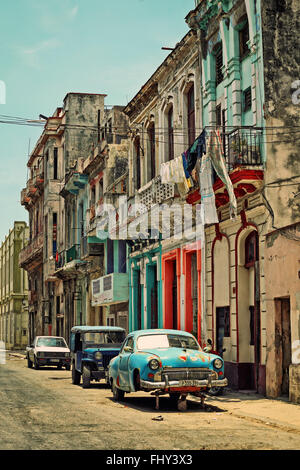 Vintage American car on the background of the old colonial buildings of Old Havana. Vintage style photo Stock Photo