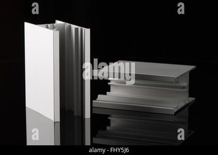 Aluminium profile sample isolated on black background. Stock Photo