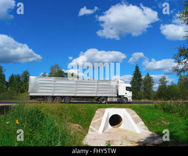 Truck on asphalt road on summer day Stock Photo