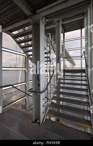 Example of a Metal and Steel Constructed Fire Escape with ability to see through the outer walls to the scenery outside Stock Photo