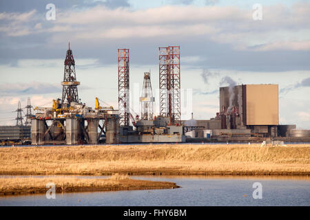 A Jackup Drilling Rig, the ENSCO 70, laid up beside Hartlepool nuclear power station in northeast England. Stock Photo