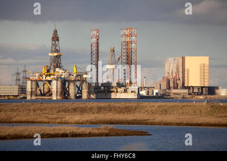 A Jackup Drilling Rig, the ENSCO 70, laid up beside Hartlepool nuclear power station in northeast England. Stock Photo
