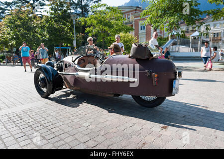 Merano, Italy - July 9, 2015: start of the Morgan Three Wheeler super sports with the owner and driver Leonhard Lösch on the sq Stock Photo