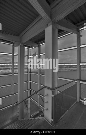 Example of a Metal and Steel Constructed Fire Escape with ability to see through the outer walls to the scenery outside Stock Photo