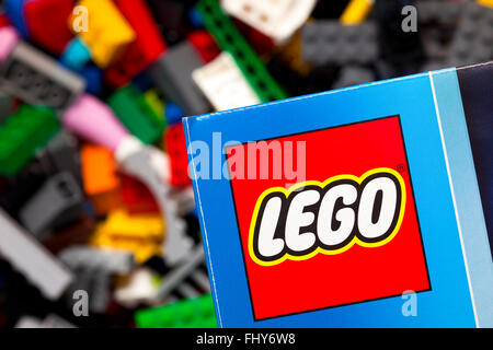 Tambov, Russian Federation - January 12, 2015 Lego logo on the box against Lego blocks background. Studio shot. Stock Photo