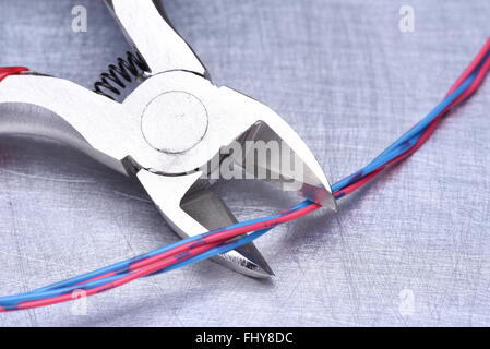 Pliers with cables and bunch of cable ties Stock Photo