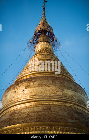 Built by King Mindon in 1857 at the foot of Mandalay Hill, Kuthodaw Pagoda houses what is known as The World's Largest Book, which consists of 729 kyauksa gu or stone-inscription caves, each containing a marble slab inscribed on both sides with a page of text from the Tipitaka, the entire Pali Canon of Theravada Buddhism. Stock Photo